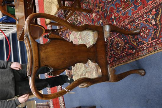 A pair of George I style walnut and parcel-gilt dining chairs